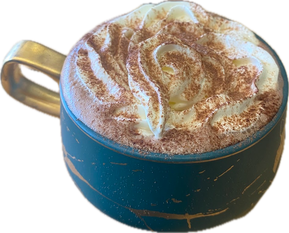 A teal and gold mug of hot chocolate topped with swirled cream and dusted cocoa
